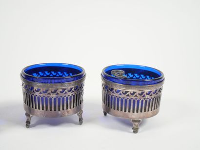Set of four openwork silver salerons decorated...
