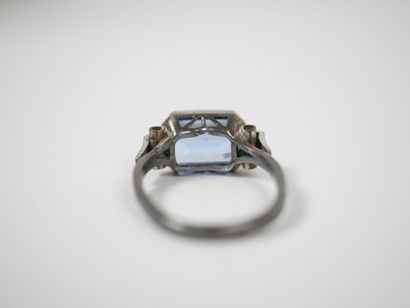 Silver ring set with a probable emerald-cut...
