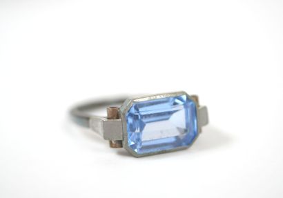 Silver ring set with a probable emerald-cut...