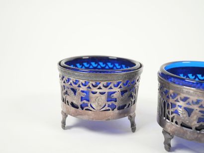 Set of four openwork silver salerons decorated...