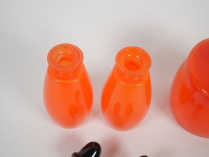 Orange-colored glass toiletry set including...