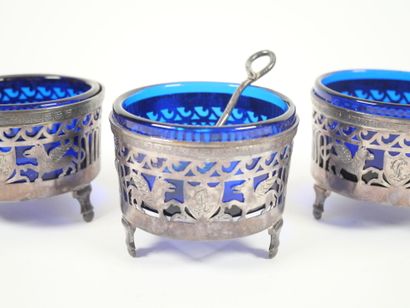 Set of four openwork silver salerons decorated...