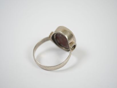 Two metal rings, one with five rows of white...