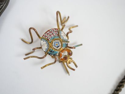 Lot of metal costume jewelry including mechanical...