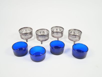 Set of four openwork silver salerons decorated...