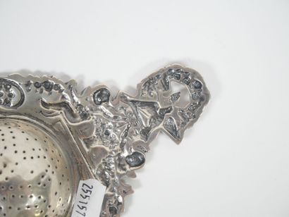 Foreign silver tea-pot decorated with cherubs...