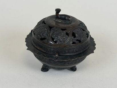 ASIA, 20th century.
Tripod openwork bronze...