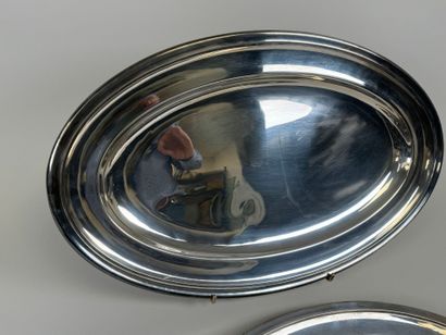 Two large oval silver-plated serving dishes.
54...