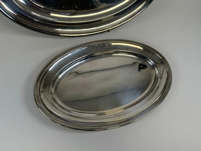 Two large oval silver-plated serving dishes.
54...