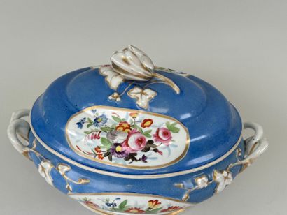 A large polychrome porcelain tureen decorated...