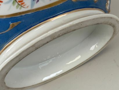 A large polychrome porcelain tureen decorated...