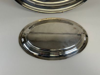 Two large oval silver-plated serving dishes.
54...