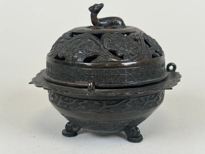 ASIA, 20th century.
Tripod openwork bronze...