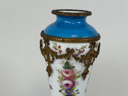 A polychrome porcelain vase decorated with...