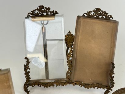 Three chased brass picture frames, two of...