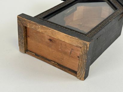 Small display case in blackened wood, triangular...