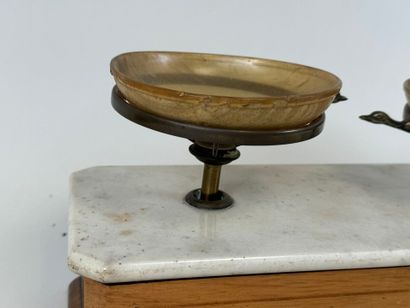 Tobacco scale in light wood and marble.
17...