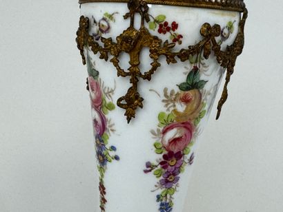 A polychrome porcelain vase decorated with...