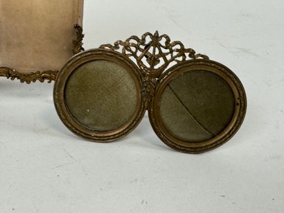Three chased brass picture frames, two of...