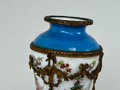A polychrome porcelain vase decorated with...