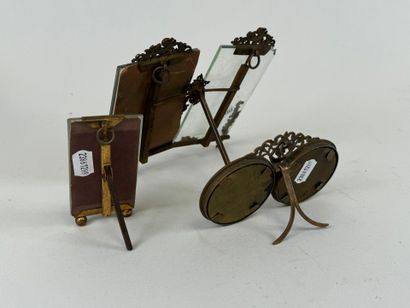 Three chased brass picture frames, two of...