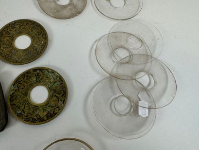 Set of glass, brass and chased bronze bobèches.
D....