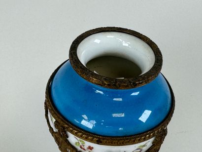 A polychrome porcelain vase decorated with...