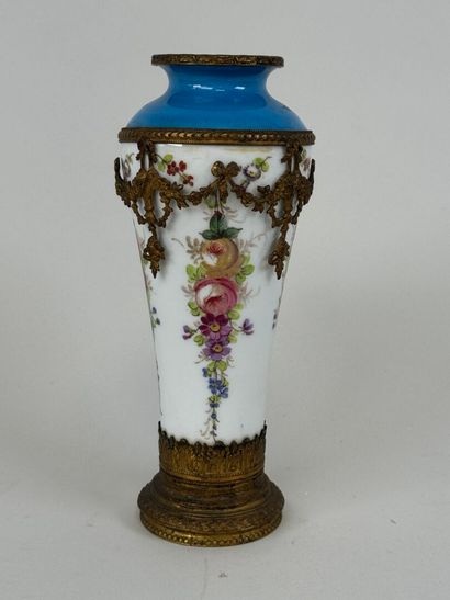 A polychrome porcelain vase decorated with...