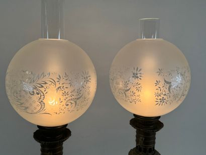 Pair of polychrome porcelain oil lamps, chased...