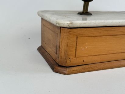 Tobacco scale in light wood and marble.
17...
