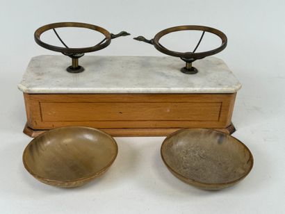 Tobacco scale in light wood and marble.
17...