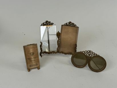 Three chased brass picture frames, two of...