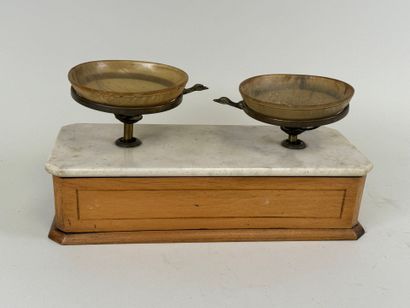 Tobacco scale in light wood and marble.
17...