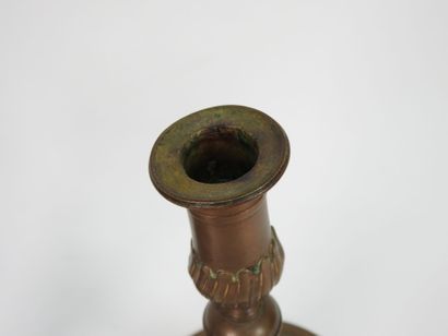 Pair of bronze candlesticks, the vase-shaped...