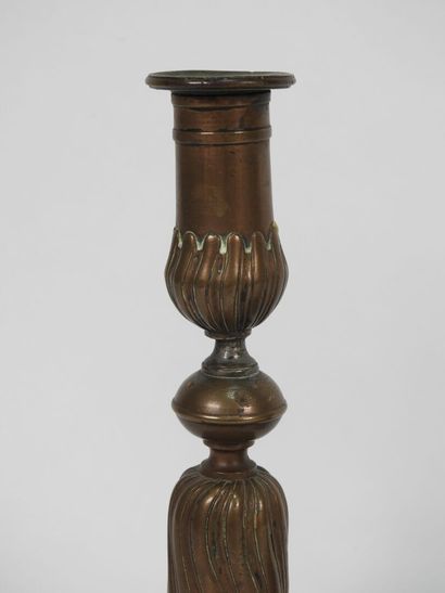 Pair of bronze candlesticks, the vase-shaped...