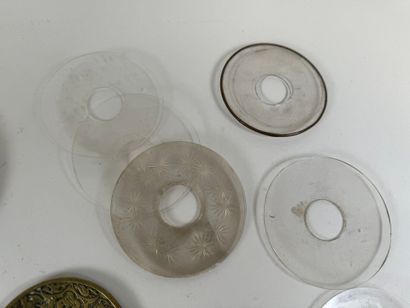 Set of glass, brass and chased bronze bobèches.
D....