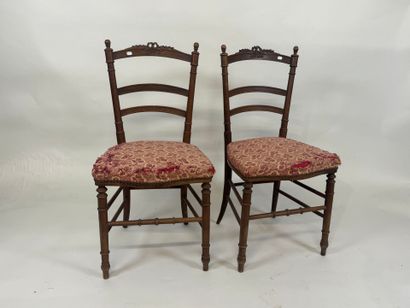 Pair of chairs in molded wood, the openwork...