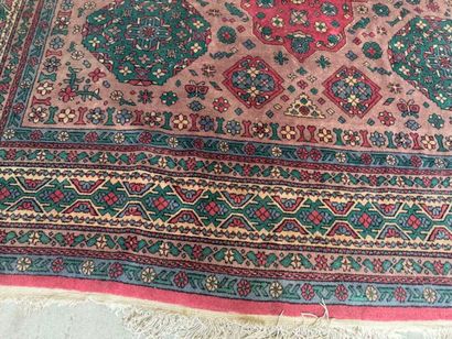 *
Large wool carpet with geometric and stylized...