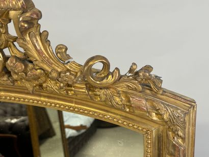 Large wood and gilded stucco mirror with...