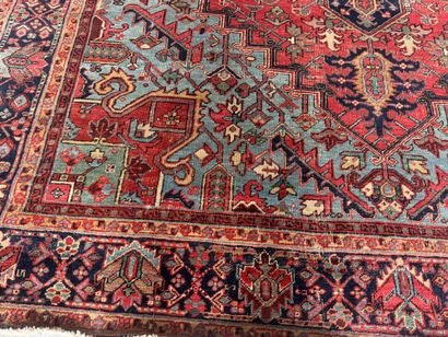 Large hand-knotted wool rug decorated with...