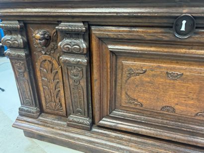Large molded and carved oak desk decorated...