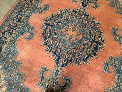 Large hand-knotted wool rug with stylized...
