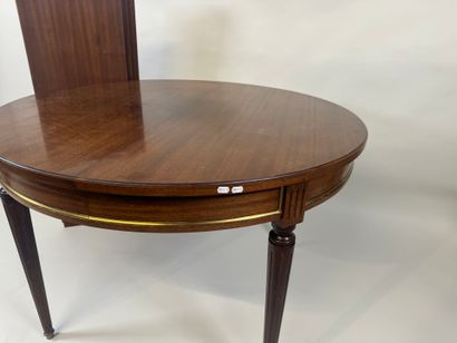 Circular table with molded wood entablature.
Louis...