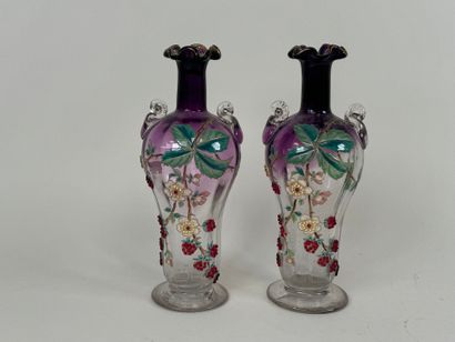 Pair of vases in partially colored and enameled...