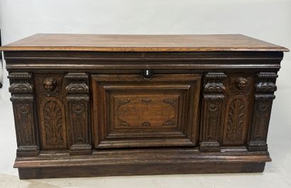 Large molded and carved oak desk decorated...