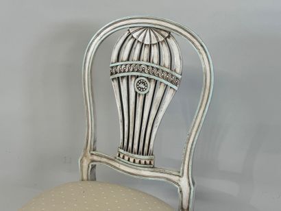 Molded wood chair, the back decorated with...