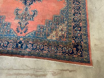 Large hand-knotted wool rug with stylized...
