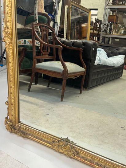 Large gilded and carved wood mirror with...