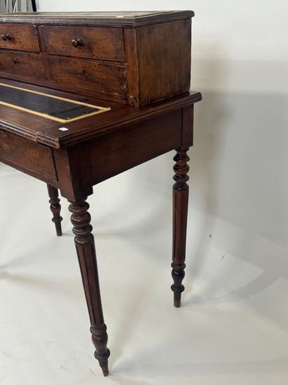 Stained wood stepped desk opening with a...