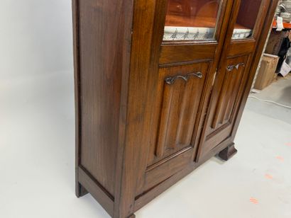 Stained-wood display case opening with two...